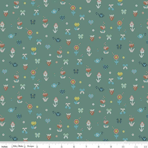 Image of the Sunsetridge Mosaic Lodge Pole quilting cotton fabric by Minki Kim for Riley Blake Designs. Features pixels on a green background. Cute Little Fabric Shop