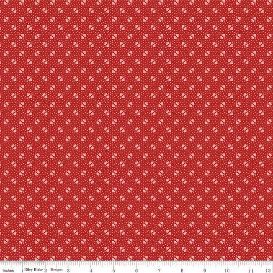 Image of the Americana Unity Schoolhouse quilting cotton fabric by Lori Holt for Riley Blake Designs. Features flowers on a red background. Cute Little Fabric Shop