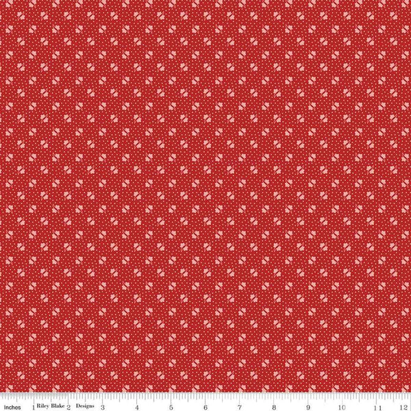 Image of the Americana Unity Schoolhouse quilting cotton fabric by Lori Holt for Riley Blake Designs. Features flowers on a red background. Cute Little Fabric Shop