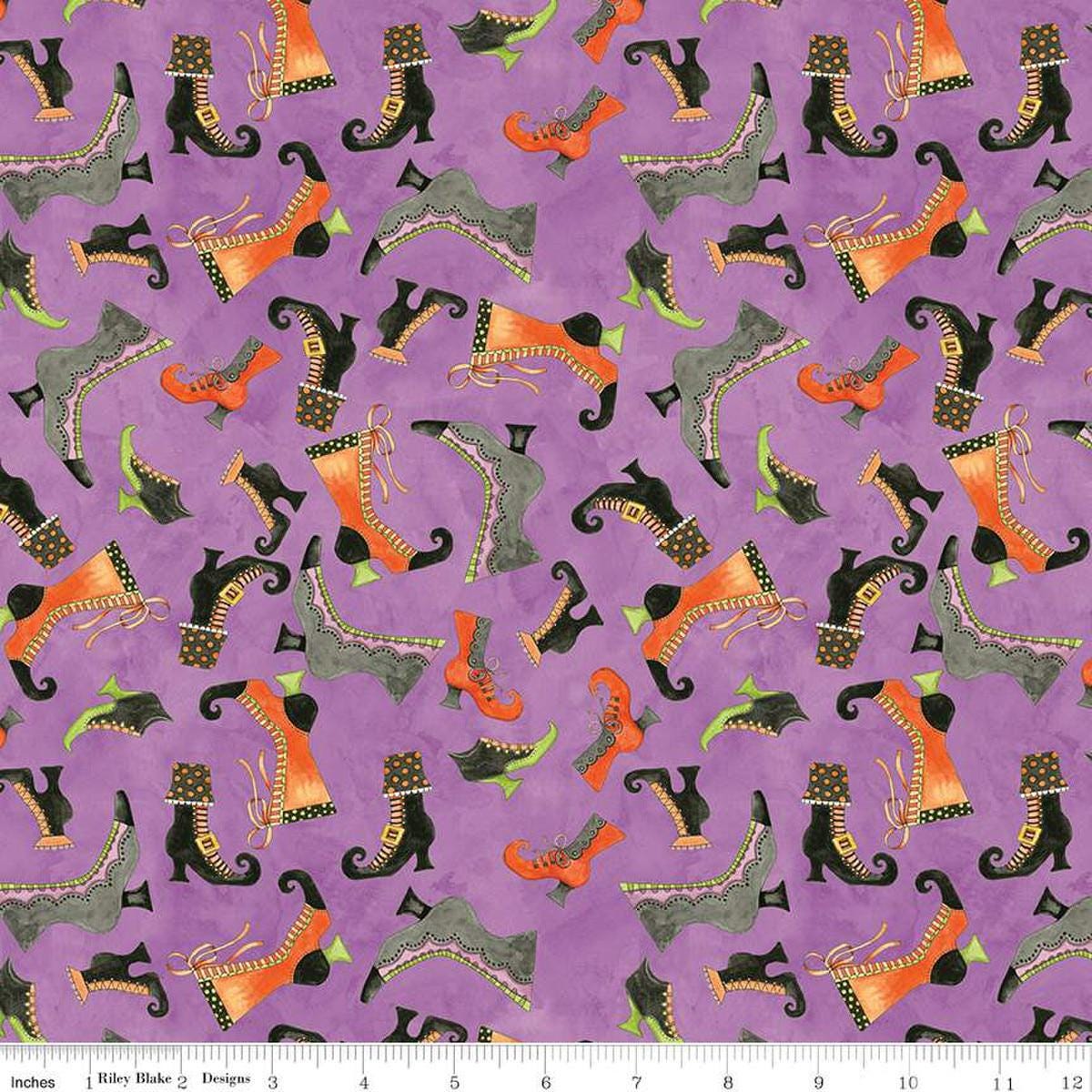 Image of the Ghoul Friends Boots Toss Purple quilting cotton fabric by Teresa Kogut for Riley Blake Designs. Features boots on a purple background. Cute Little Fabric Shop
