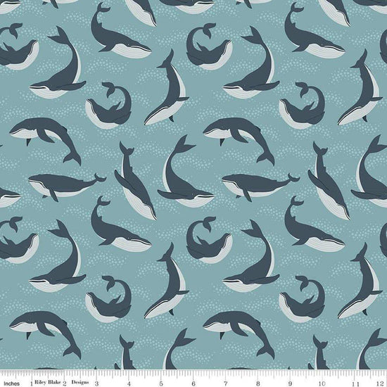 Image of the Alaska Whales Blue quilting cotton fabric. Features whales on a blue background. Cute Little Fabric Shop