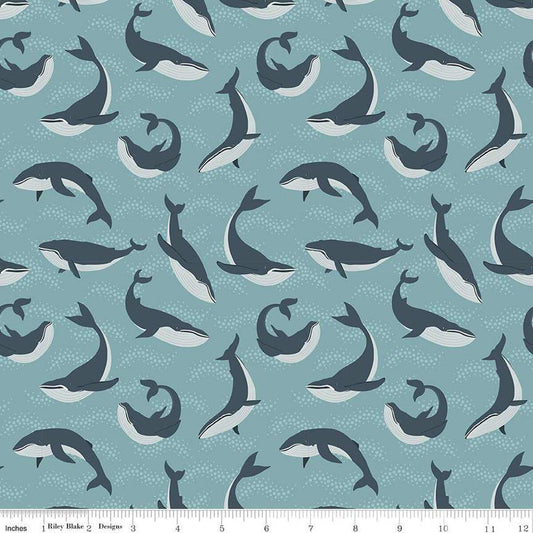 Image of the Alaska Whales Blue quilting cotton fabric. Features whales on a blue background. Cute Little Fabric Shop