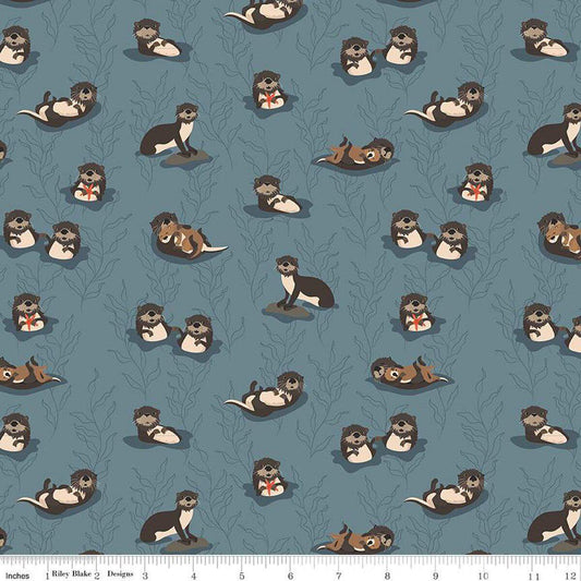 Image of the Alaska Sea Otters Blue quilting cotton fabric by Riley Blake Designs. Features animals on a blue background. Cute Little Fabric Shop