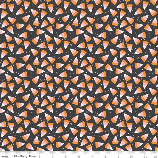 Image of the Hey Pumpkin Corn Candy Charcoal quilting cotton fabric by Riley Blake Designs. Features candy on a black background. Cute Little Fabric Shop