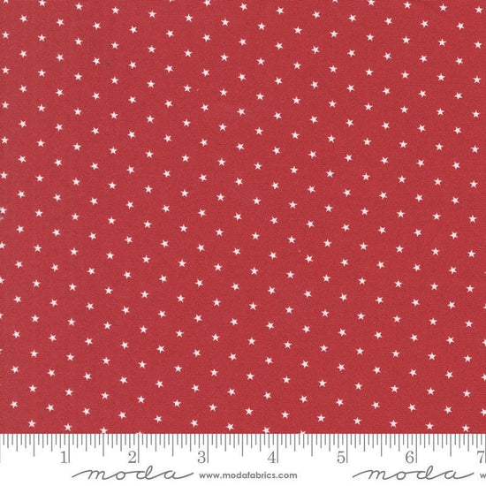 Image of the Star Spangled Twinkle Rocket quilting cotton fabric by Moda Fabrics. Features stars on a red background. Cute Little Fabric Shop