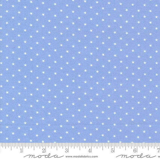 Image of the Star Spangled Twinkle Dawn quilting cotton fabric by Moda Fabrics. Features stars on a blue background. Cute Little Fabric Shop