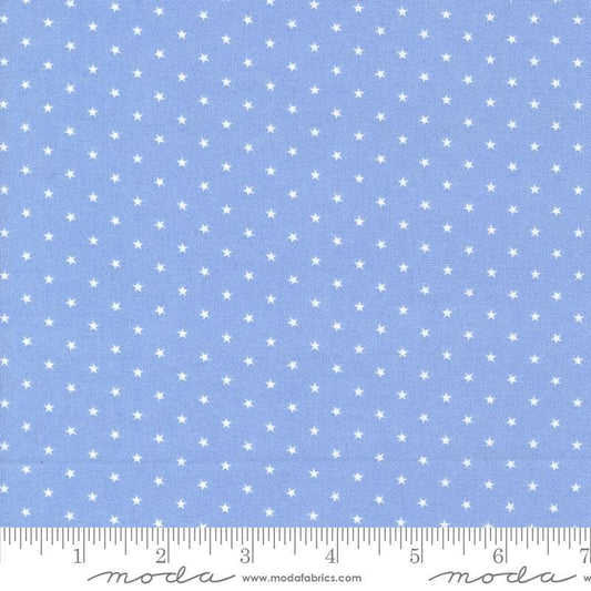 Image of the Star Spangled Twinkle Dawn quilting cotton fabric by Moda Fabrics. Features stars on a blue background. Cute Little Fabric Shop