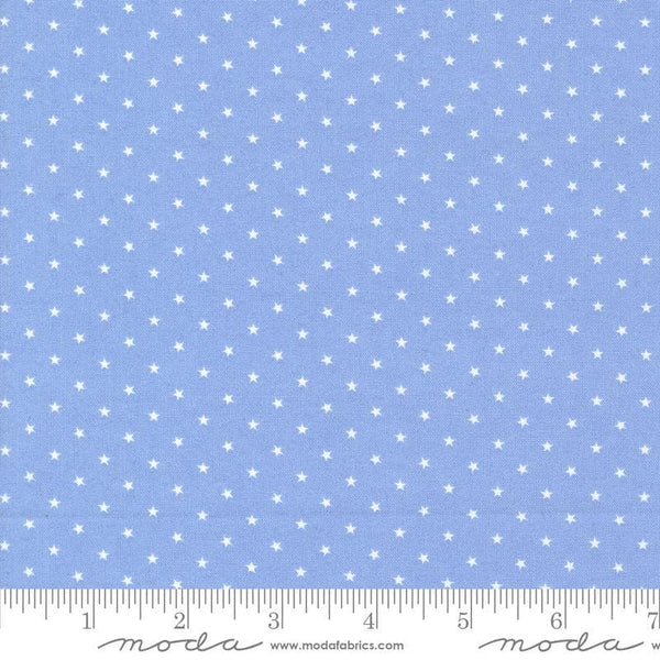 Image of the Star Spangled Twinkle Dawn quilting cotton fabric by Moda Fabrics. Features stars on a blue background. Cute Little Fabric Shop