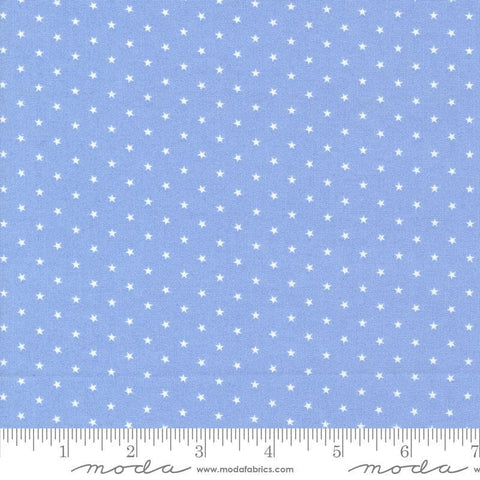 Image of the Star Spangled Twinkle Dawn quilting cotton fabric by Moda Fabrics. Features stars on a blue background. Cute Little Fabric Shop