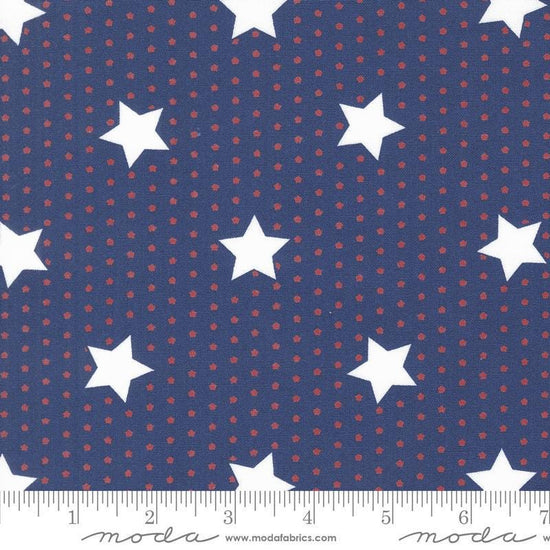 Image of the Star Spangled Stars Twilight quilting cotton fabric by Moda Fabrics. Features stars on a blue background. Cute Little Fabric Shop