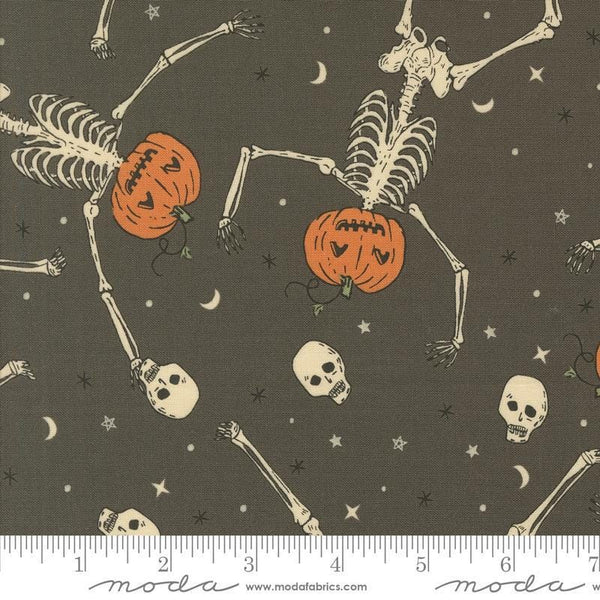 Image of the Home Sweet Haunt Skeletons Stone quilting cotton fabric by Moda Fabrics. Features halloween icons on a brown background. Cute Little Fabric Shop