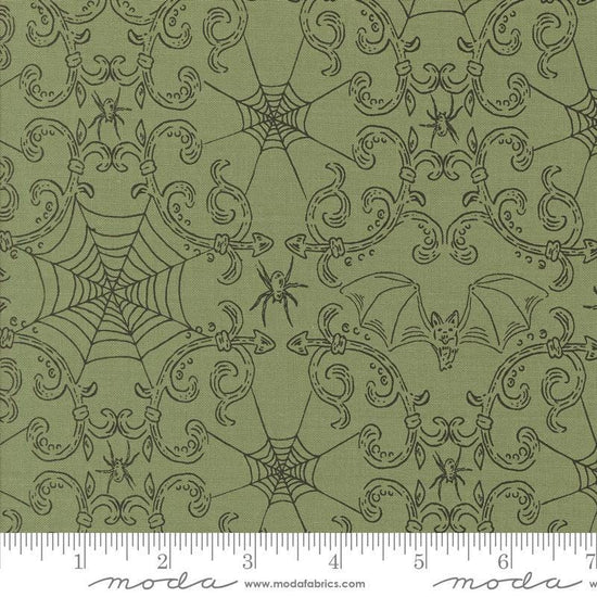 Image of the Home Sweet Haunt Webs Moss  quilting cotton fabric by Moda Fabrics. Features spiderwebs on a green background. Cute Little Fabric Shop