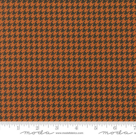 Image of the Home Sweet Haunt Houndstooth Rust quilting cotton fabric by Moda Fabrics. Features houndstooth on an orange background. Cute Little Fabric Shop