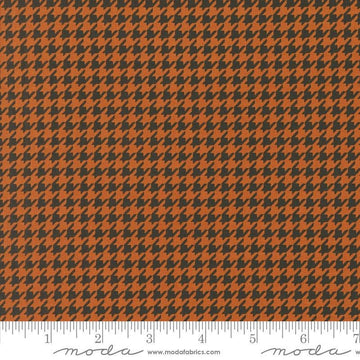 Image of the Home Sweet Haunt Houndstooth Rust quilting cotton fabric by Moda Fabrics. Features houndstooth on an orange background. Cute Little Fabric Shop