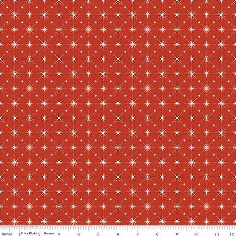Image of Christmas Is in Town Stars Red by Riley Blake Designs. Features arranged sparkle stars on a red background. 
Cute Little Fabric Shop