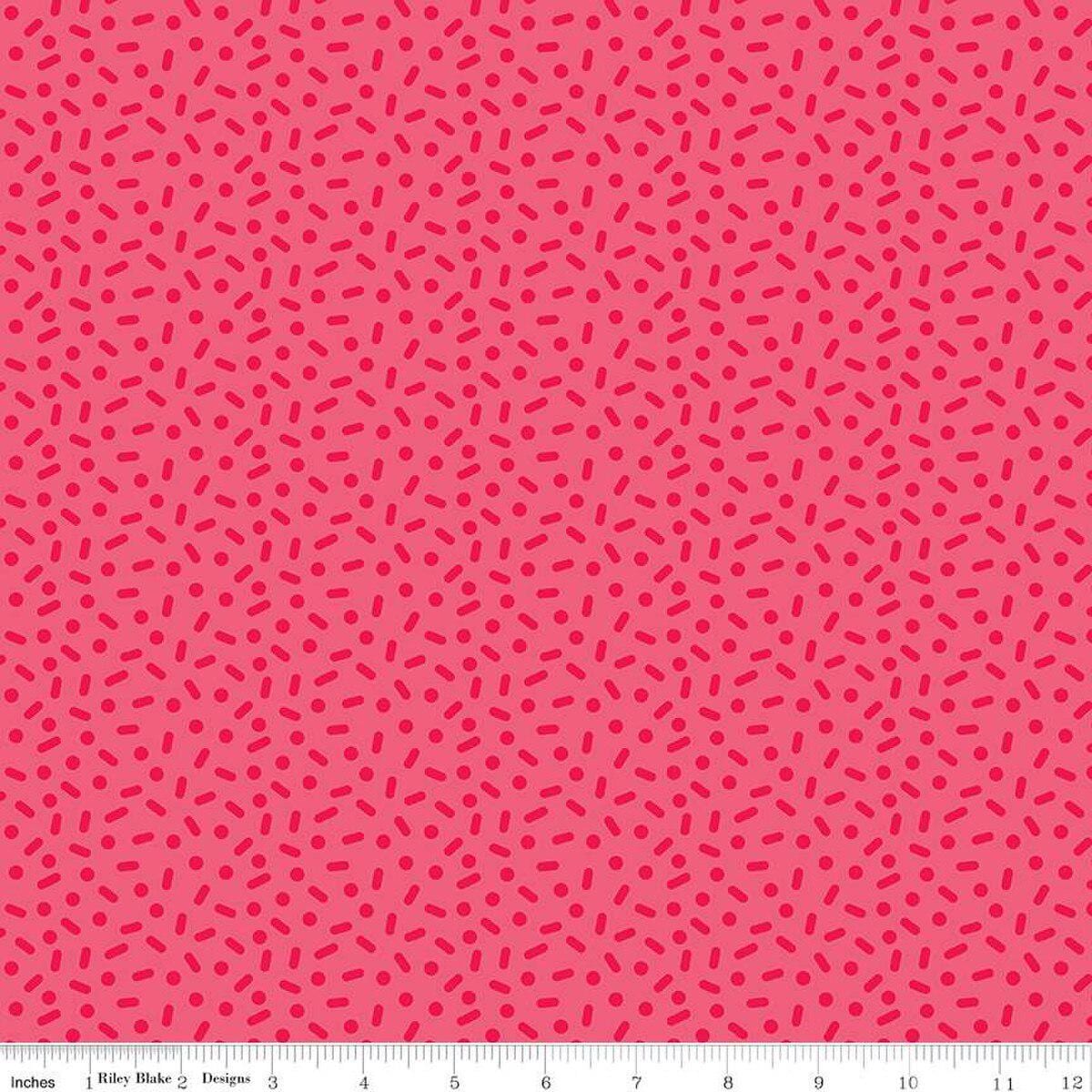 Image of the Gingerbread Kisses Sprinkles Red quilting cotton fabric. Features sprinkles on a red background. Cute Little Fabric Shop