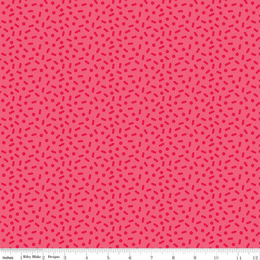 Image of the Gingerbread Kisses Sprinkles Red quilting cotton fabric. Features sprinkles on a red background. Cute Little Fabric Shop