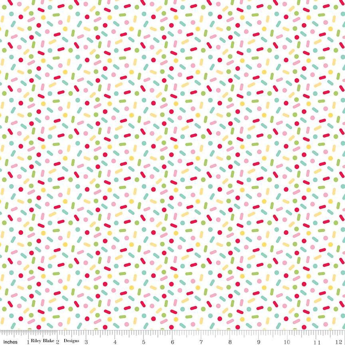 Image of the Gingerbread Kisses Sprinkles Multi quilting cotton fabric. Features sprinkles on a white background. Cute Little Fabric Shop