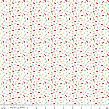 Image of the Gingerbread Kisses Sprinkles Multi quilting cotton fabric. Features sprinkles on a white background. Cute Little Fabric Shop