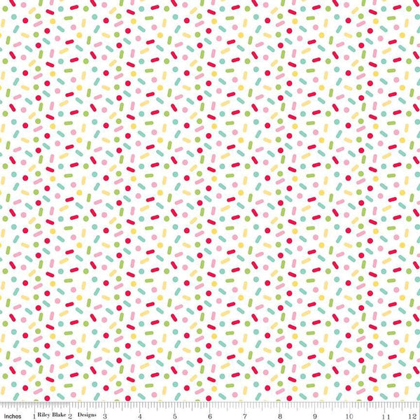 Image of the Gingerbread Kisses Sprinkles Multi quilting cotton fabric. Features sprinkles on a white background. Cute Little Fabric Shop