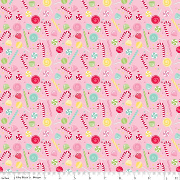 Image of the Gingerbread Kisses Sweets Pink quilting cotton fabric. Features candy on a pink background. Cute Little Fabric Shop