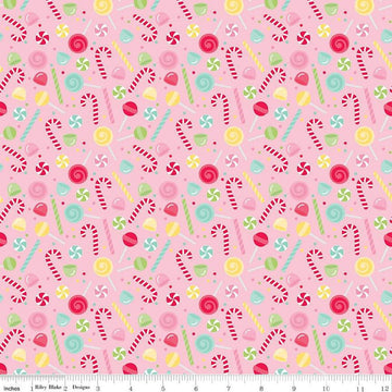 Image of the Gingerbread Kisses Sweets Pink quilting cotton fabric. Features candy on a pink background. Cute Little Fabric Shop
