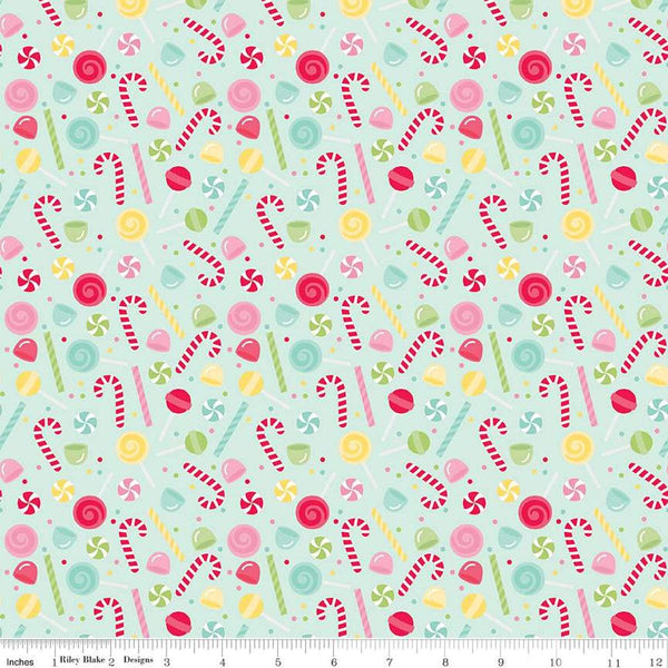 Image of the Gingerbread Kisses Sweets Blue quilting cotton fabric. Features candy on a blue background. Cute Little Fabric Shop