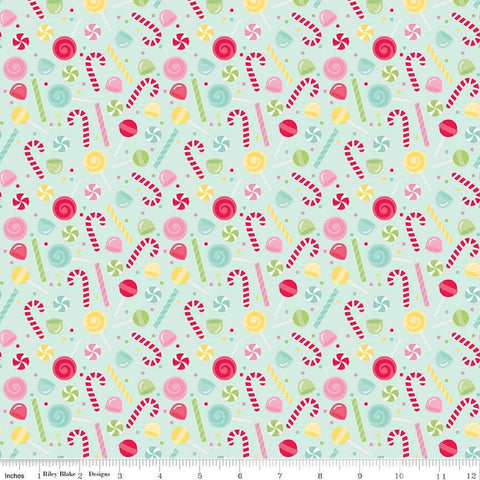 Image of the Gingerbread Kisses Sweets Blue quilting cotton fabric. Features candy on a blue background. Cute Little Fabric Shop
