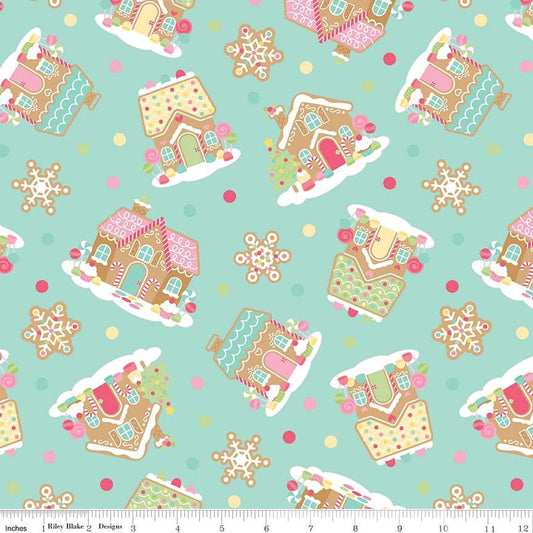Image of the Gingerbread Kisses Main Blue quilting cotton fabric. Features icons on a blue background. Cute Little Fabric Shop