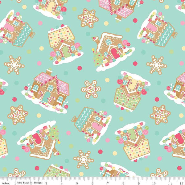 Image of the Gingerbread Kisses Main Blue quilting cotton fabric. Features icons on a blue background. Cute Little Fabric Shop