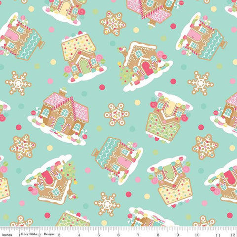 Image of the Gingerbread Kisses Main Blue quilting cotton fabric. Features icons on a blue background. Cute Little Fabric Shop