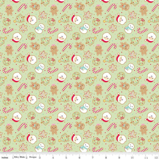 Image of the Gingerbread Kisses Sugar Cookies Green quilting cotton fabric. Features cookies on a green background. Cute Little Fabric Shop