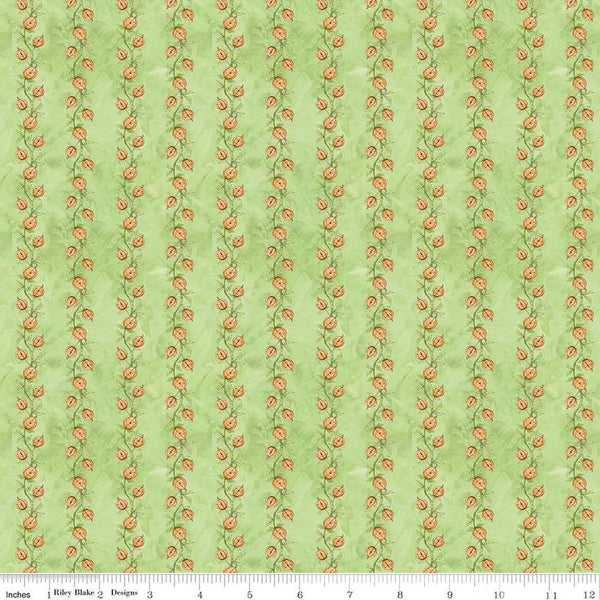 Image of the Ghoul Friends Pumpkin Vine Green quilting cotton fabric by Teresa Kogut for Riley Blake Designs. Features pumpkin stripes on a green background. Cute Little Fabric Shop