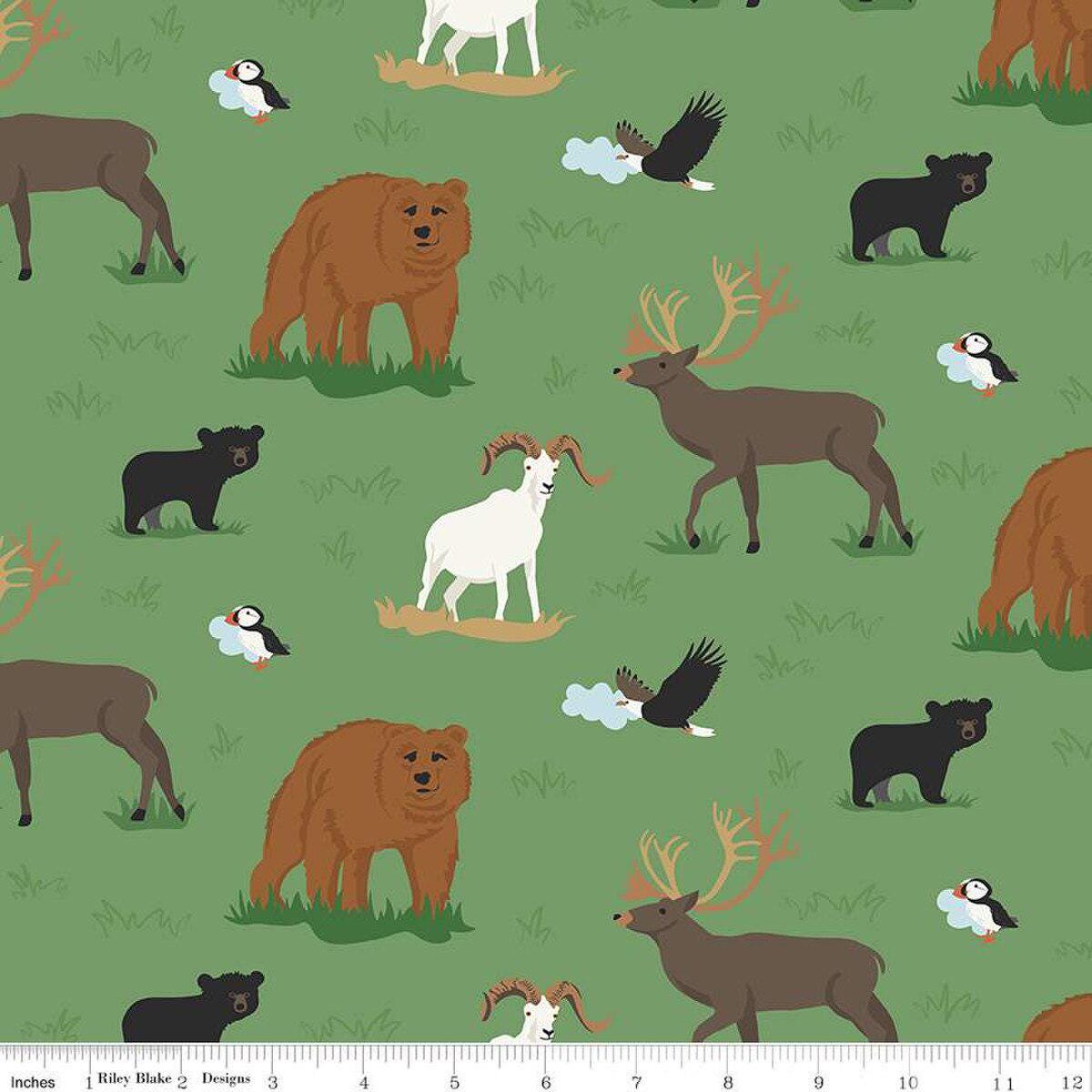 Image of the Alaska Wildlife Green quilting cotton fabric by Riley Blake Designs. Features animals on a green background. Cute Little Fabric Shop