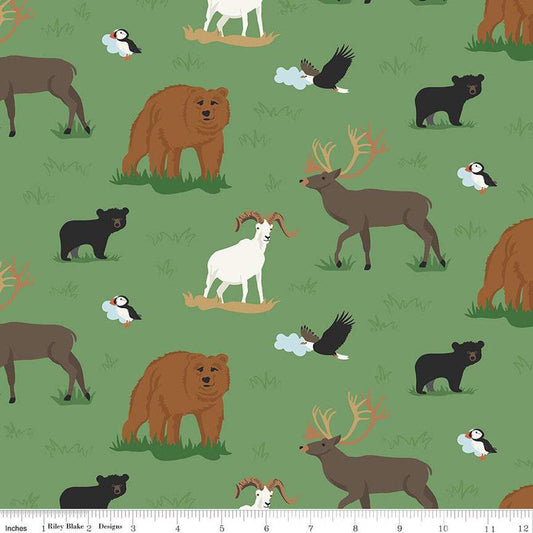 Image of the Alaska Wildlife Green quilting cotton fabric by Riley Blake Designs. Features animals on a green background. Cute Little Fabric Shop