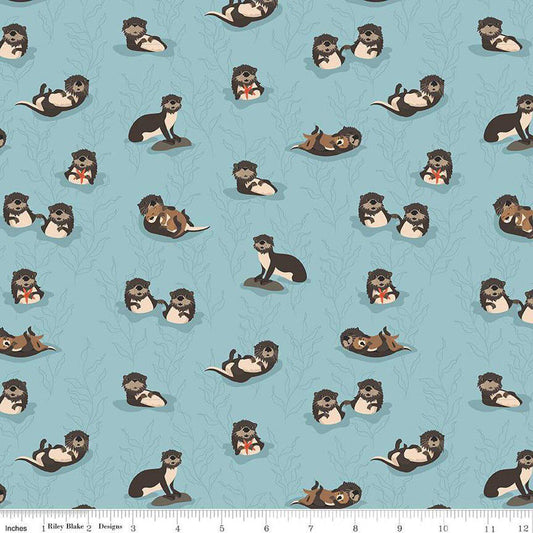 Image of the Alaska Sea Otters Aqua quilting cotton fabric by Riley Blake Designs. Features animals on a blue background. Cute Little Fabric Shop