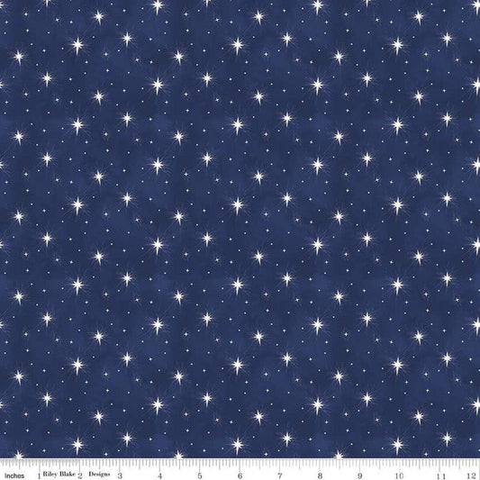 Image of the Come Let Us Adore Him Stars Navy quilting cotton fabric. Features stars on a blue background. Cute Little Fabric Shop