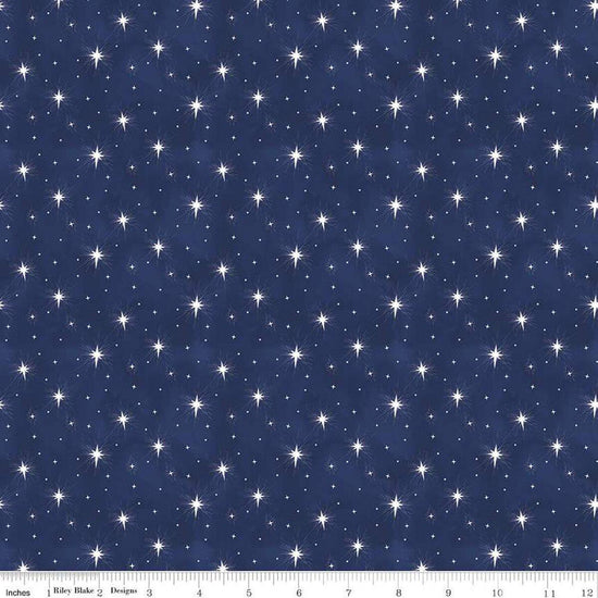 Image of the Come Let Us Adore Him Stars Navy quilting cotton fabric. Features stars on a blue background. Cute Little Fabric Shop
