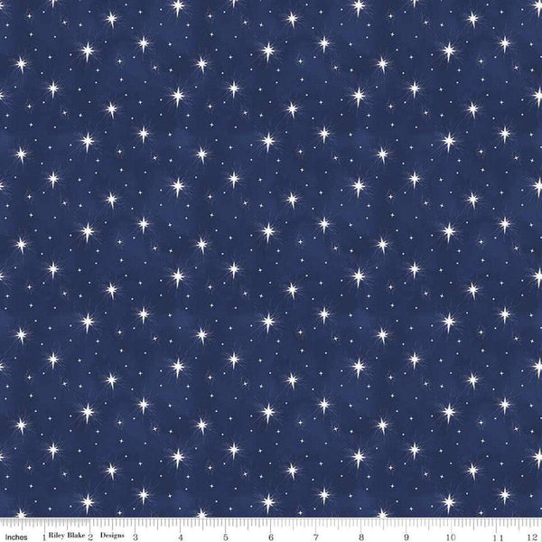 Image of the Come Let Us Adore Him Stars Navy quilting cotton fabric. Features stars on a blue background. Cute Little Fabric Shop