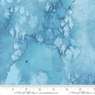 Image of the Wanderlust Flow Basics River quilting cotton fabric. Features abstract paint on a blue background. Cute Little Fabric Shop