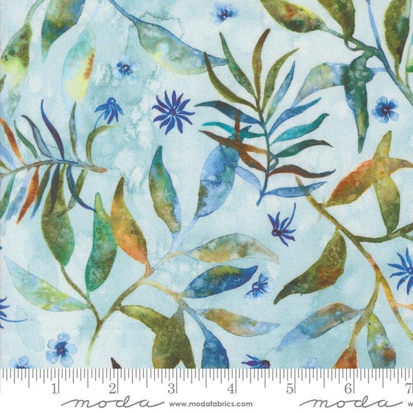 Image of the Wanderlust Fronds Dawn quilting cotton fabric. Features leaves on a blue background. Cute Little Fabric Shop
