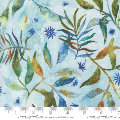Image of the Wanderlust Fronds Dawn quilting cotton fabric. Features leaves on a blue background. Cute Little Fabric Shop