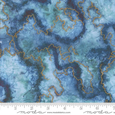 Image of the Wanderlust Geode River quilting cotton fabric. Features paint on a blue background. Cute Little Fabric Shop