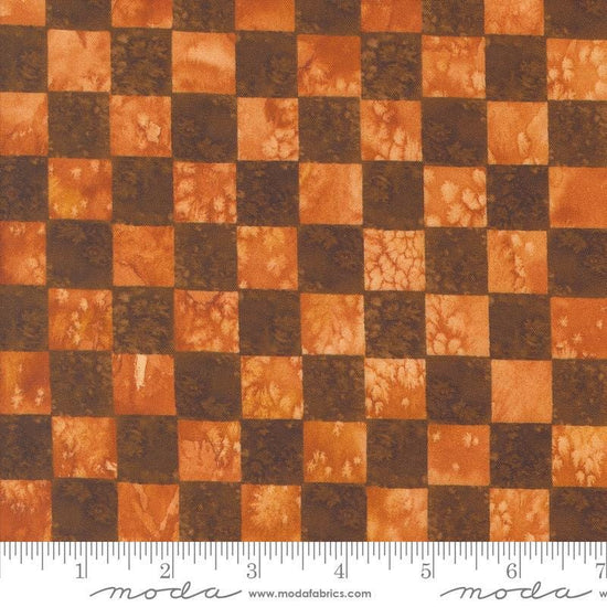 Image of the Wanderlust Checks Red Ochre quilting cotton fabric. Features checks on a red background. Cute Little Fabric Shop