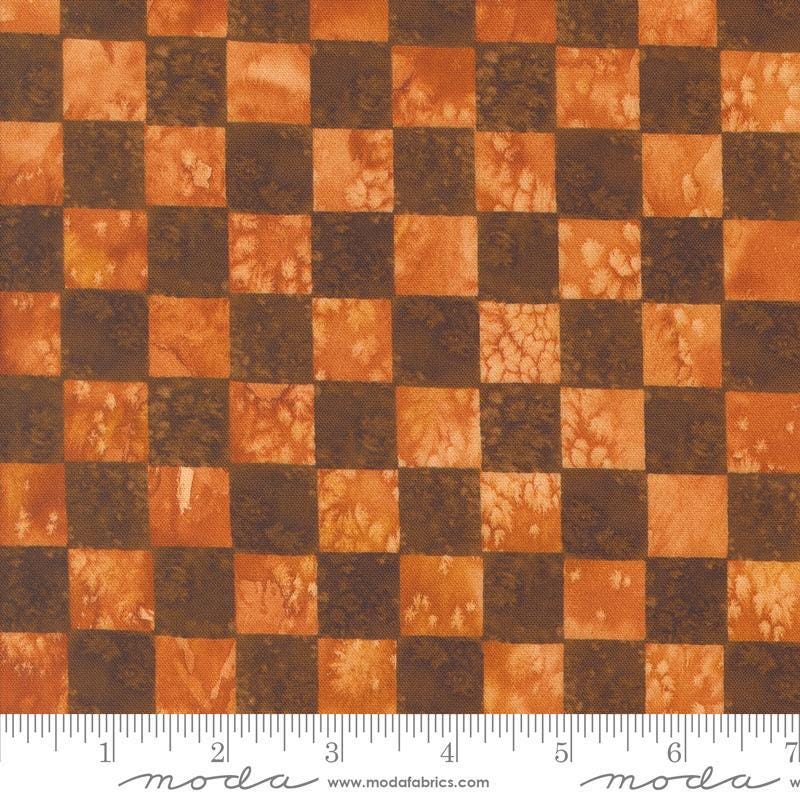 Image of the Wanderlust Checks Red Ochre quilting cotton fabric. Features checks on a red background. Cute Little Fabric Shop