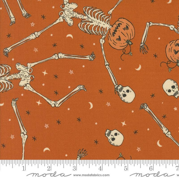 Image of the Home Sweet Haunt Skeletons Rust quilting cotton fabric by Moda Fabrics. Features halloween icons on an orange background. Cute Little Fabric Shop