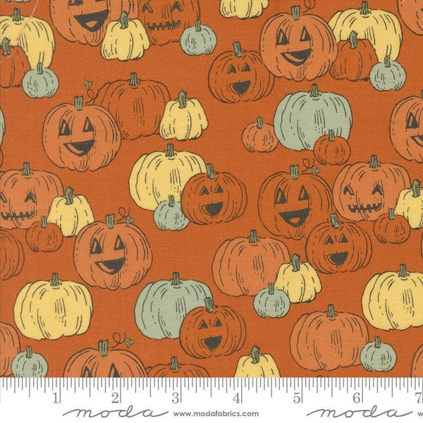 Image of the Home Sweet Haunt Pumpkins Rust quilting cotton fabric by Moda Fabrics. Features pumpkins on an orange background. Cute Little Fabric Shop