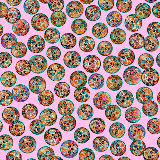 Image of the Skullduggery Mini Sugar Skulls Pink quilting cotton fabric by Morris Creative Group by QT Fabrics. Features skulls on a pink background. Cute Little Fabric Shop