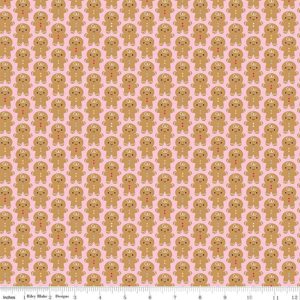 Image of the Gingerbread Kisses Gingerbread Men Pink quilting cotton fabric. Features gingerbread men on a pink background. Cute Little Fabric Shop