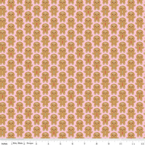 Image of the Gingerbread Kisses Gingerbread Men Pink quilting cotton fabric. Features gingerbread men on a pink background. Cute Little Fabric Shop